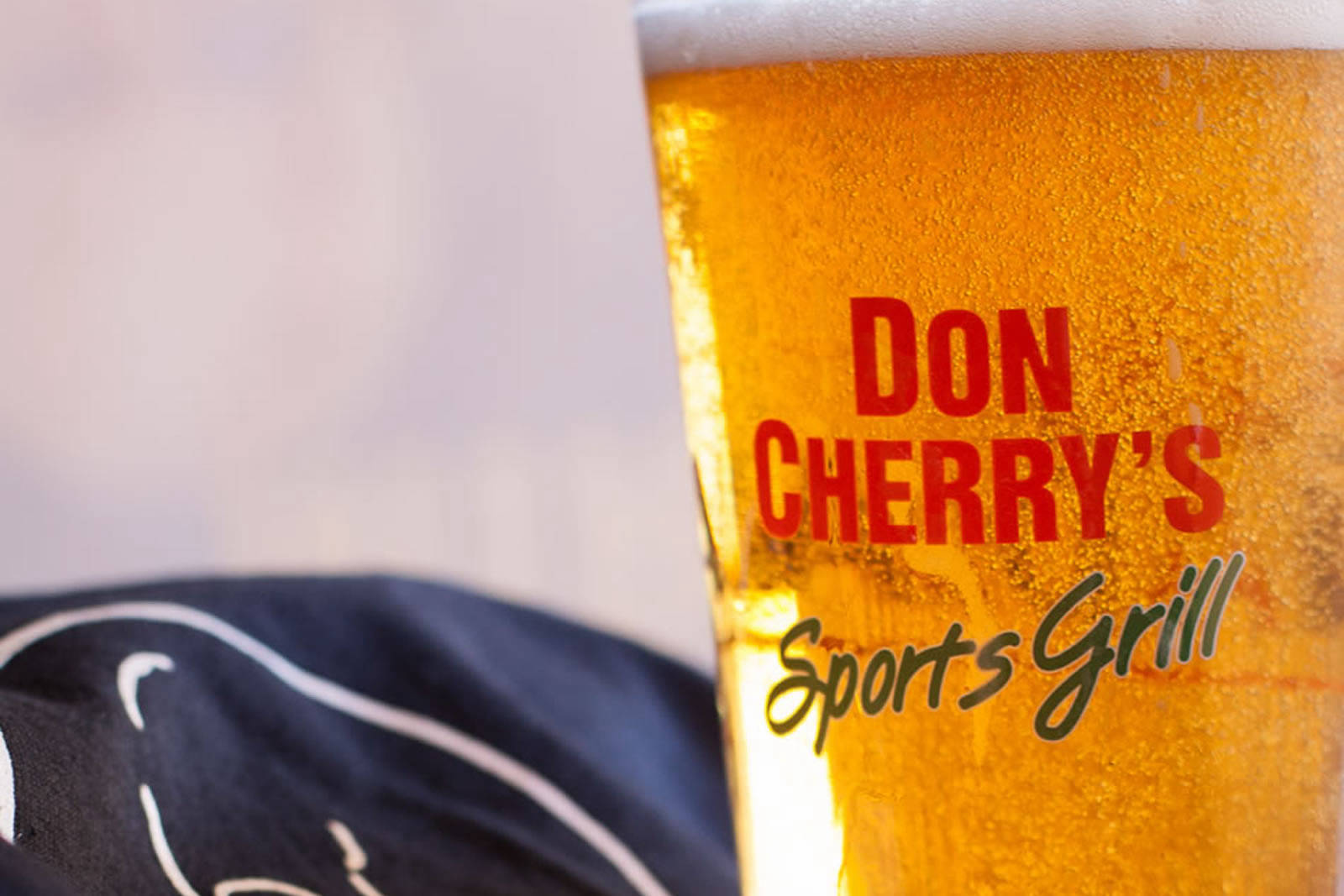 An ice cold draft beer with the Don Cherry's logo on the front.